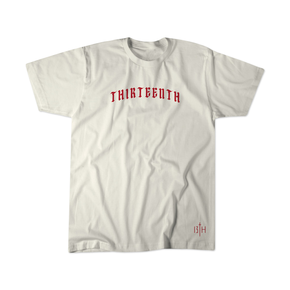 The Serpent's And Doves Premium Tee by 13th is a plain white shirt with "THIRTEENTH" in bold red gothic letters across the chest, inspired by Matthew 10:16, and a small red 13th logo near the bottom hem.