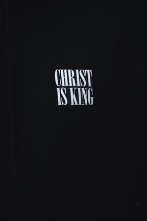 White “CHRIST IS KING” text stands out on the black Christ is King Premium Hoodie by 13th, making it a bold statement of faith.