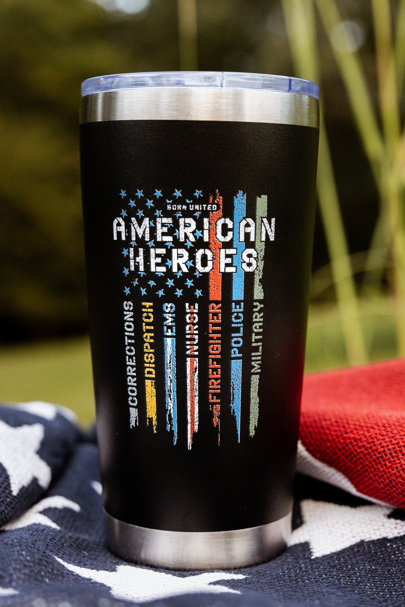 The Born United Private Label "American Heroes Tumbler - 20oz" features colored stripes for Corrections, Dispatch, EMS, Firefighter, Police, and Military—perfect for celebrating service on the go.