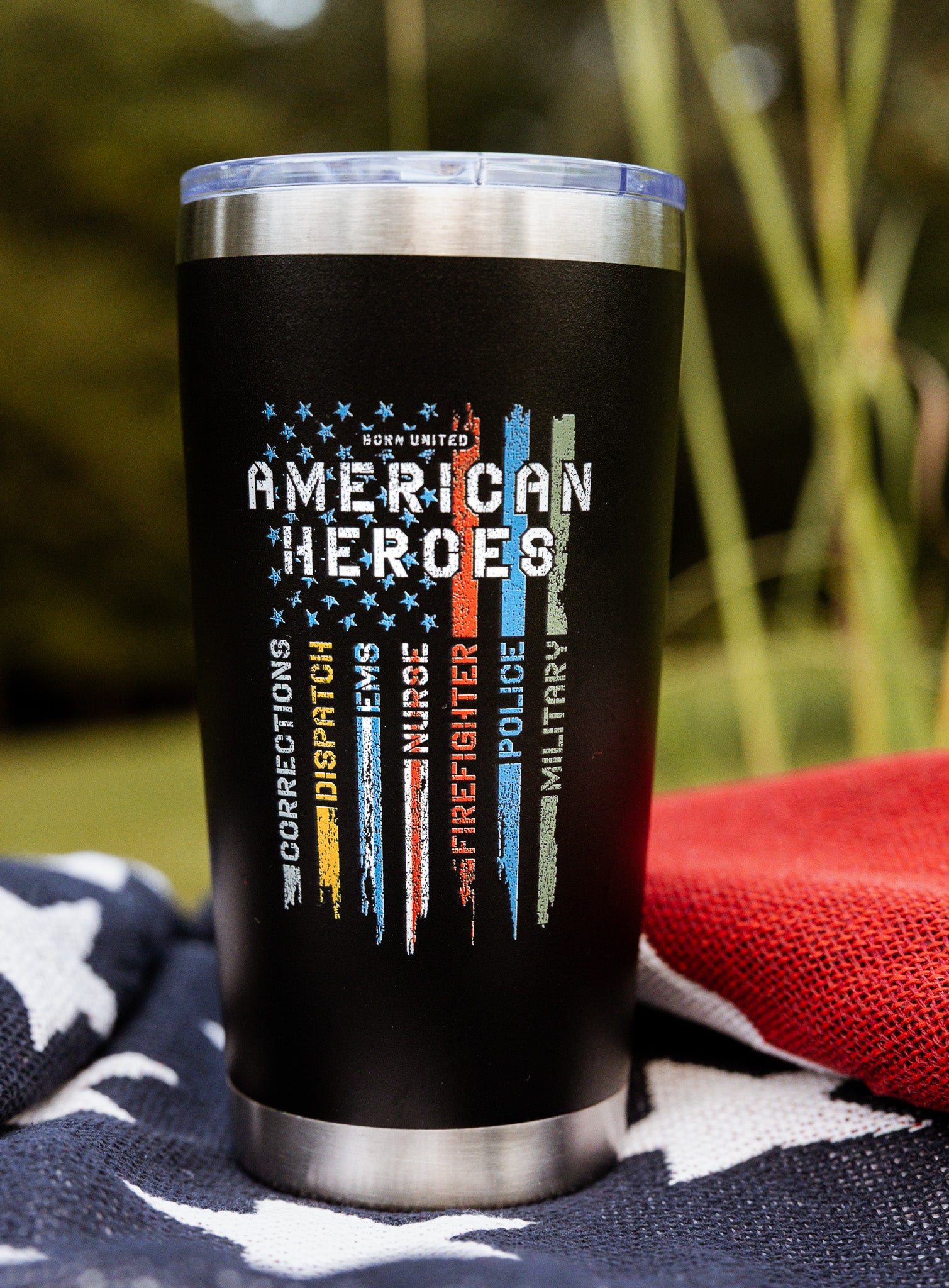 The Born United Private Label "American Heroes Tumbler - 20oz" features colored stripes for Corrections, Dispatch, EMS, Firefighter, Police, and Military—perfect for celebrating service on the go.