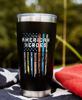 The Born United Private Label American Heroes Tumbler - 20oz showcases colored stripes and “Born United American Heroes” with Corrections, Dispatch, Nurses, Firefighter, Police, and Military on a star-patterned blanket.