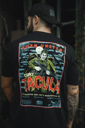 A man wears the Born United Private Label “Count Tacula” tee, a limited edition black Halloween shirt with a vivid vampire-and-gun graphic under a full moon. The back features “Born United,” “Count Tacula,” and extra slogans.