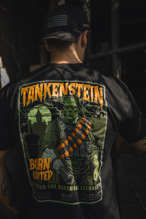 A man in a black cap and Tankenstein T-shirt by Born United Private Label stands with his back to the camera; the exclusive shirt displays a Frankenstein-like soldier graphic with "TANKENSTEIN" and "Born United" text.