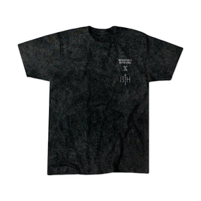 A black, short-sleeved Tattooed Child of God Premium Mineral Wash T-Shirt by Relentless Betrayal features subtle textures and bold Christian graphics, laid flat on a white background.
