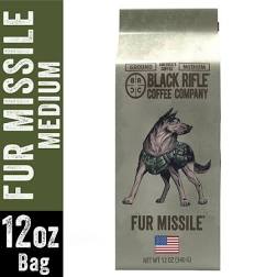 Black Rifle Coffees Fur Missile 12oz Ground is a medium roast featuring an illustrated German Shepherd in a harness with an American flag. The label reads “Fur Missile Medium.”.