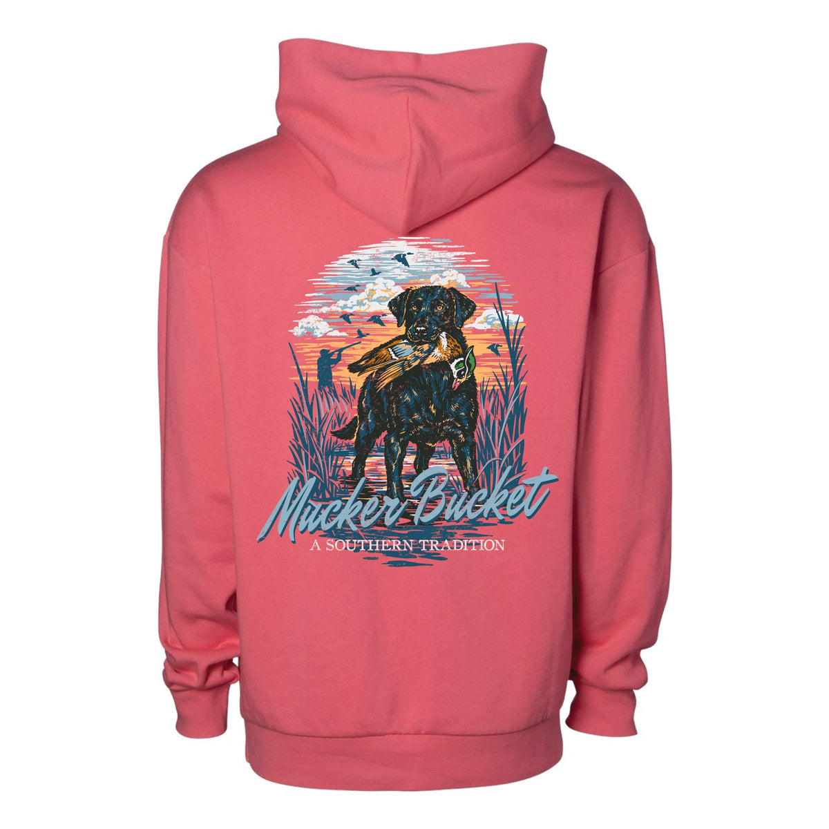 Pink premium relaxed fit The Waterfowler Premium Hoodie featuring a graphic on the back of a black retriever holding a duck in a marsh at sunset, with the text Mucker Bucket A Southern Tradition.
