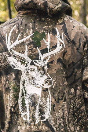 Back view of a person wearing The Rut Realtree Premium Hoodie, featuring a Realtree camo pattern and a large white graphic of a deer head on the back.
