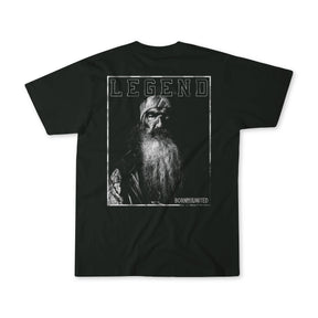 The Legend Dynasty black T-shirt by Born United Private Label showcases a black-and-white photo of an older man with a long beard and beanie, LEGEND above, and BORN UNITED at the bottom.