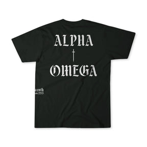 The 13th Alpha Omega Premium Tee in black features white gothic “ALPHA” above a cross and “OMEGA” below on the back, plus small white text by the lower hem.