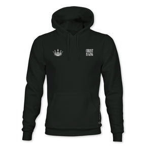 The Christ is King Premium Hoodie by 13th features a black design with a small white crown on the left chest and CHRIST IS KING text on the right, plus a front pocket and drawstring hood.