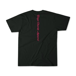 The Feral Tee by Tango Charlie Apparel is a black unisex cotton t-shirt featuring "Fargo Comix Apparel" in pink vertical script down the back—comfortable and perfect for everyday wear.