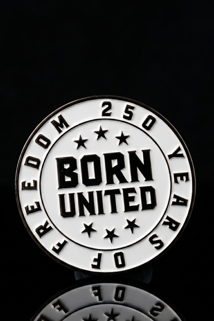 A round pin from Born United Patriot Box by Born United Private Label features black and white text: “250 Years of Freedom” around the edge, “Born United” in bold at the center, seven stars, and a black background—ideal for collectors or fans.