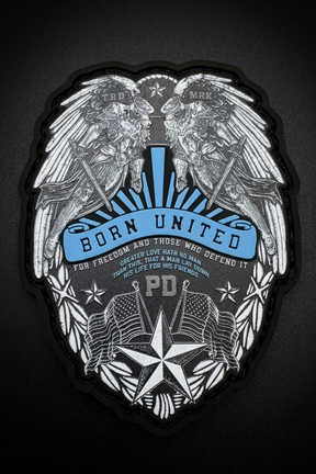 Emblem with wings, flags, and text 'Born United' on a dark background