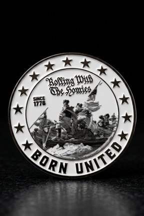 A round challenge coin by Born United Private Label, featuring George Washington crossing the Delaware and stars. Text: “Rolling With The Homies,” “Since 1776,” “Born United.” A must-have from the Born United Patriot Box for true patriots.