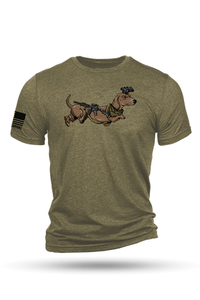 The Nine Line Apparel Tactical Weiner T-Shirt in olive green features a cartoon tactical dachshund with gear on the chest and “Hound with the rounds” plus an American flag patch design on the right sleeve.