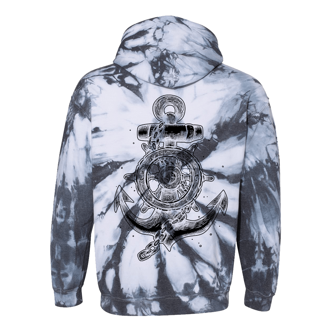 The Relentless Betrayal Youth Take the Helm Tie Dye Hoodie features a black-and-white tie-dye design and a large anchor with ship wheel and water splash graphic on the back.