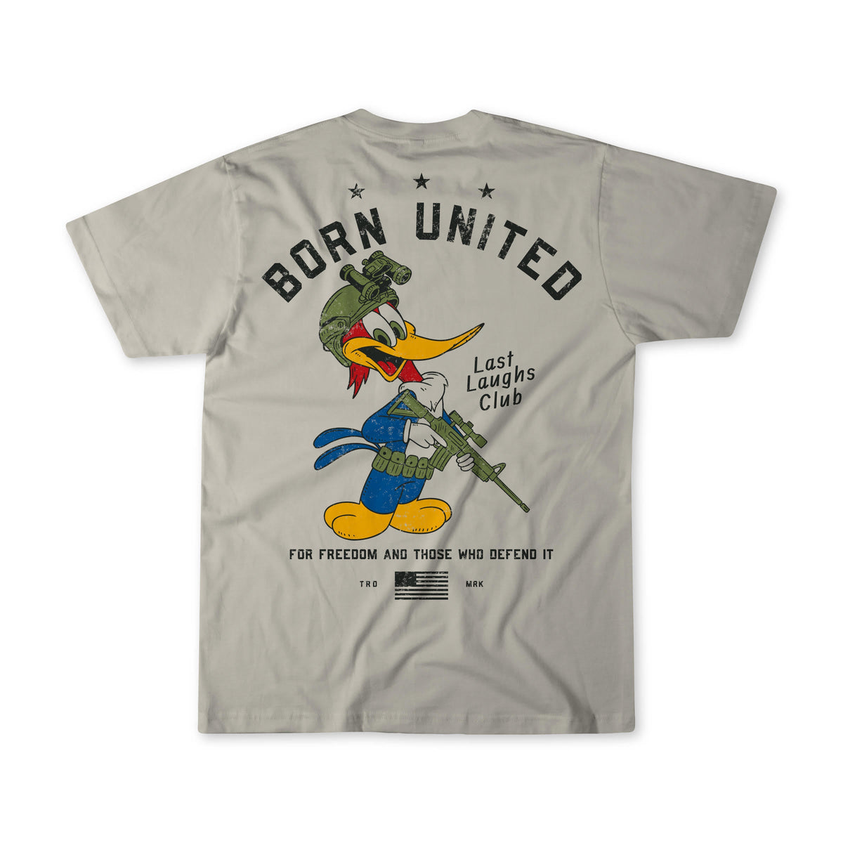 The Last Laughs Club Tee by Born United Private Label is a light gray shirt featuring a cartoon woodpecker in military gear with rifle, and the phrases BORN UNITED, Last Laughs Club, and For freedom and those who defend it on the back.