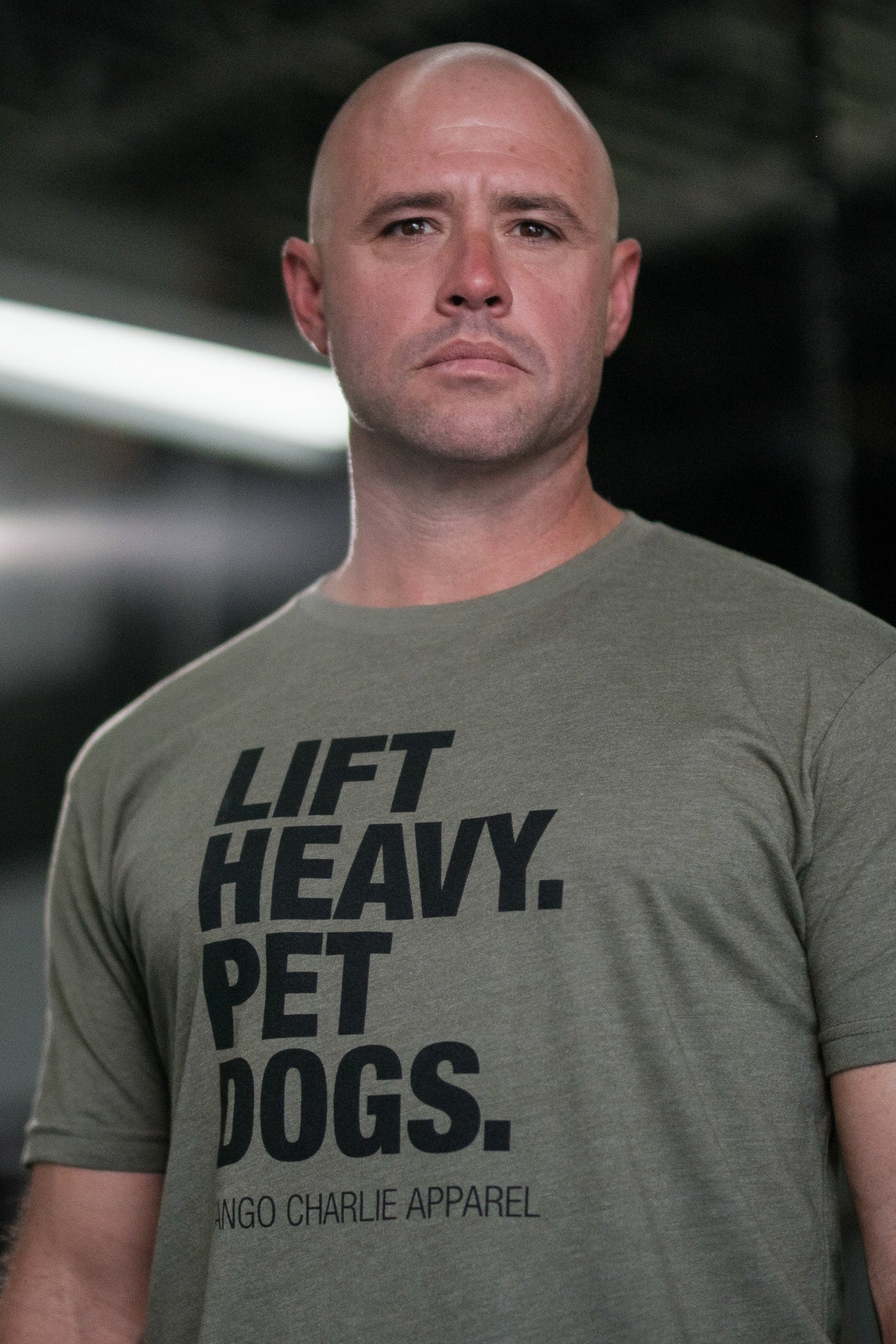 tango charlie - lift heavy pet dogs army green t-shirt on men's model