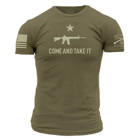 Grunt Styles Come and Take It - Military Green t-shirt displays a rifle and star graphic with the phrase above it. An American flag is on the right sleeve, while 2A Edition text is partially visible on the left sleeve.