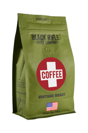 A green bag of Black Rifle Coffee’s Coffee Saves - Whole Bean, with a bold red and white COFFEE logo, an American flag at the bottom, citrus notes flavor, and a net weight of 12 oz (340 g).