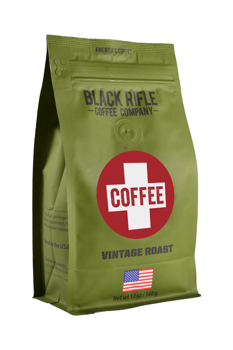 A green bag of Black Rifle Coffee’s Coffee Saves - Whole Bean, with a bold red and white COFFEE logo, an American flag at the bottom, citrus notes flavor, and a net weight of 12 oz (340 g).